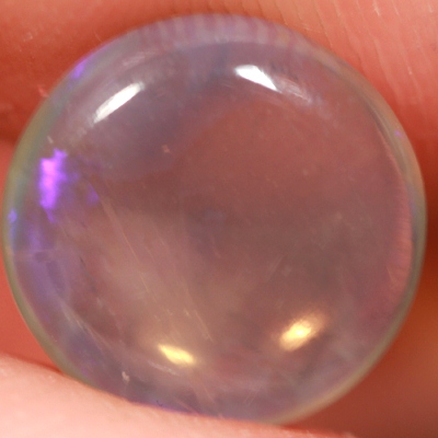 SOLID CRYSTAL OPAL Transparent with a pretty deep purple jumping